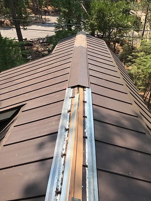 roof repairs on a metal roof